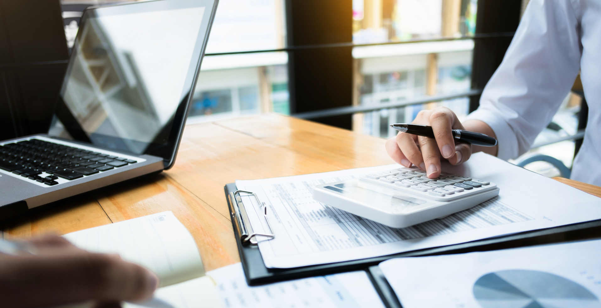 business audits using a calculator financial data investment fund at a workplace, wealth concept